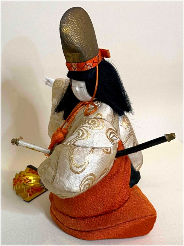 japanese traditional kimekomi doll with katana sword and folding fan