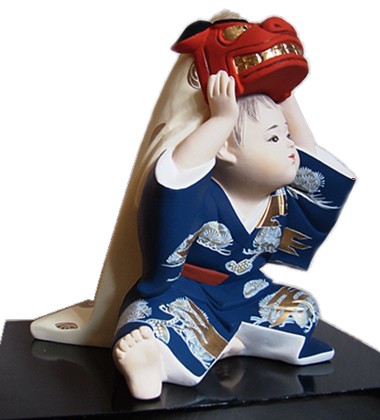 Japanese little boy with big festival mask of Shi-Shi, hakata clay doll